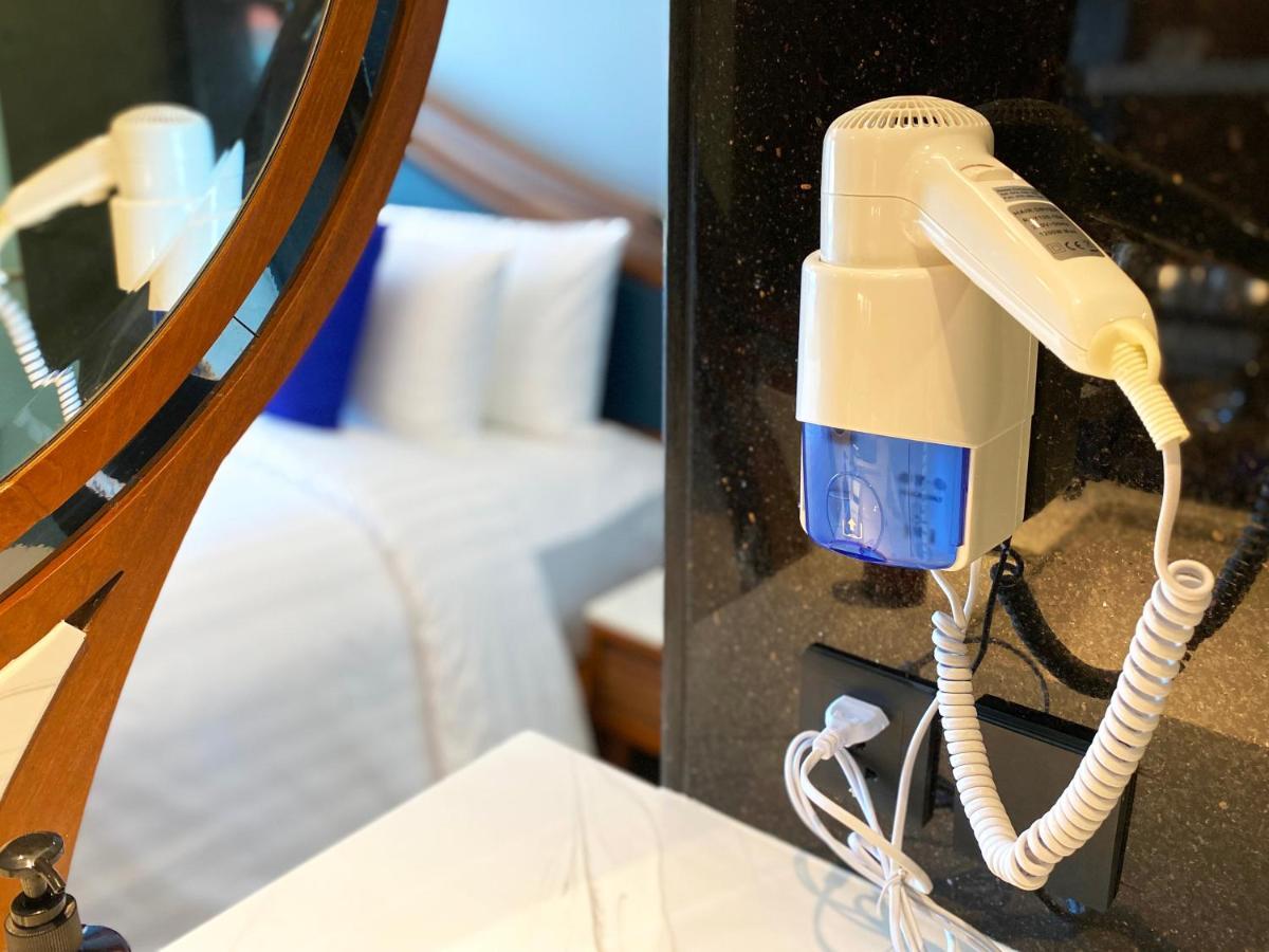 The Oceanic Sportel Phuket - Sha Extra Plus Exterior foto A hair dryer mounted on a wall